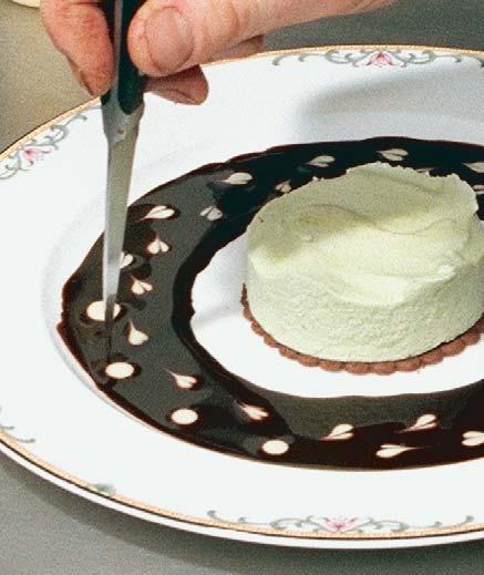 Another easy decorating method Pour a very shallow ring of chocolate sauce on the plate, and dot the chocolate using a squeeze bottle filled with crème anglaise.
