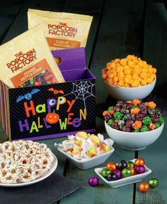 A A HAPPY HALLOWEEN 7-TIER TOWER & TIN A medley of Halloween favorites and popcorn delights in this 7-Tier Tin & Tower makes gatherings extra festive.