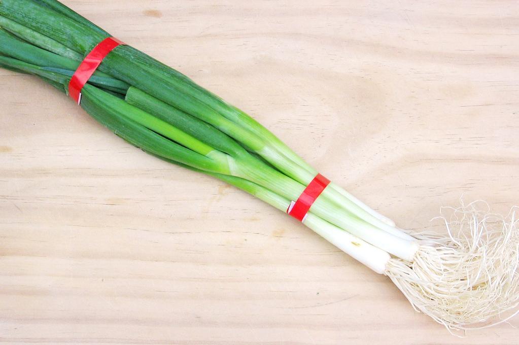 The most common method involves HARVESTING undercutting the onions, pulling them up immediately, and gathering them into bunches of five to seven. The bunches are then tied together with rubber bands.