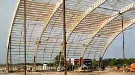 The structure is known as a wooden, bow-trussed hangar.