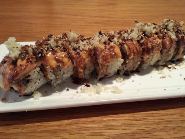 with grilled salmon, spicy mayo, eel sauce, and tempura flakes (8pc) (All