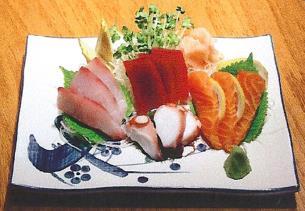 95 Chirashi* 8 pieces of nigiri sushi, 4 pieces of a California roll,