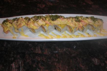 (8pc) Phoenix Roll Spicy tuna roll topped with salmon and spicy mayo (8pc) 2 pieces of fried jumbo shrimp and mango topped with shrimp, crab stick, mango, miso sauce, and shredded seaweed (8pc)