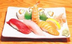 95 Sashimi Deluxe* Sashimi and vegetables over rice served with a side