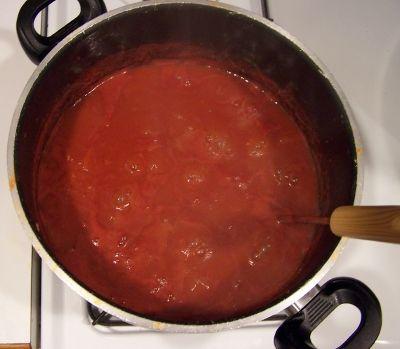 Step 5 - Heat to boiling and keep adding tomatoes Heat immediately to boiling while crushing (I use a potato masher).