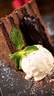 berry sauce Torta Cioccolato Dhs 47 The special Biella chocolate cake with vanilla ice cream &