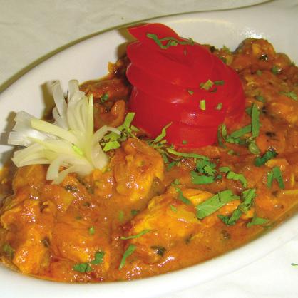95 Tender pieces of boneless chicken cooked with tomatoes, green chillies and onions in a spicy hot sauce ~ fairly hot. Korahi tikka khyberi... 7.