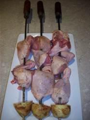 chicken on the bone with potato pieces for