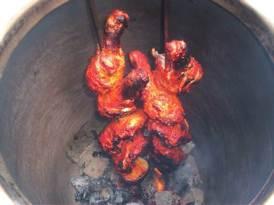 chicken cooking in Tandoor with potato