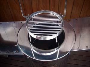7.Using the grill with your Tandoor You will never miss your conventional bbq with our bbq grill The SS1 and SS2 Deluxe and Ultima models each come with a stainless steel grill that neatly fits