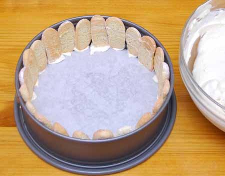 18 Arrange some of the cookies upright around the inner circumference of a 9-inch (23cm) springform pan.