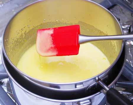 5 4 Stirring constantly, cook the yolk mixture until it thickens. This can take as long as 10 minutes.