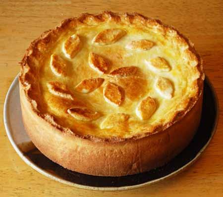 17 10 This savory pie can be served at room temperature for cold from the refrigerator. If heated, the cheese inside will melt and might result in a gooey, stringy mess when cut.
