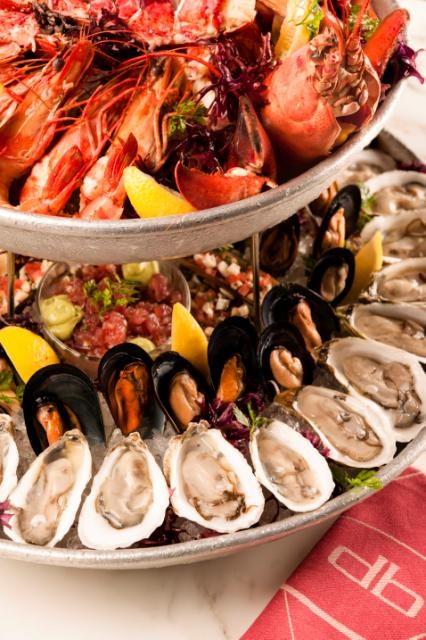 The beautiful display of fresh briny oysters is surrounded by a magnificent island