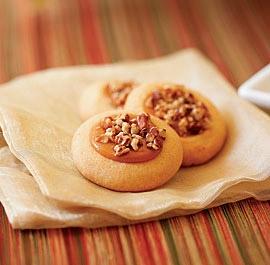 N u t t y C a r a m e l T h u m b p r i n t C o o k i e s This cookie recipe uses a great shortcut: melted store-bough caramels as a filling for the thumbprints.