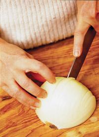 Slice off about 1-inch from the top end of the onion, discarding or saving as desired.