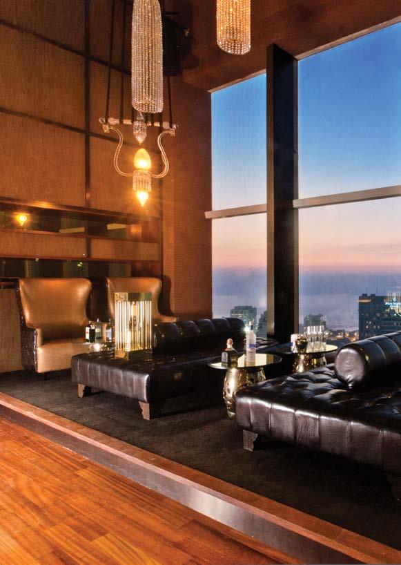 The uber luxe décor with floor-to-ceiling windows, Osler chandeliers, leather upholstery