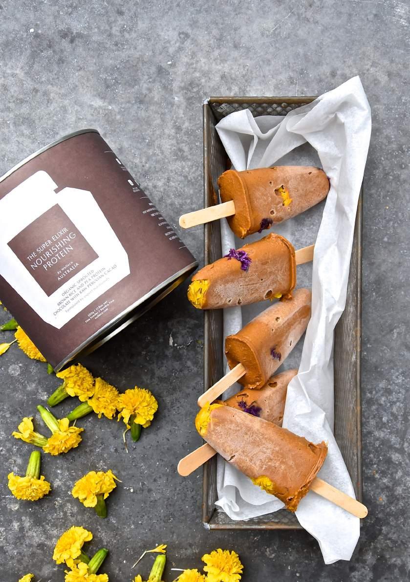 CHOCOLATE PROTEIN POPS From @fooddeco 1 sweet potato 200ml coconut milk 3 scoops THE SUPER ELIXIR Chocolate Nourishing Skin and cut the sweet potato in cubes.