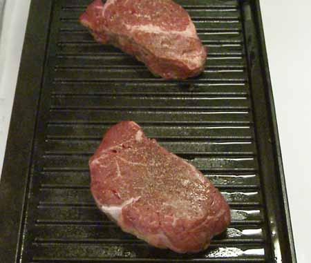 Grill or pan fry them. I am using a stove top cast iron grill because I want my steaks to have pronounced bar marks.