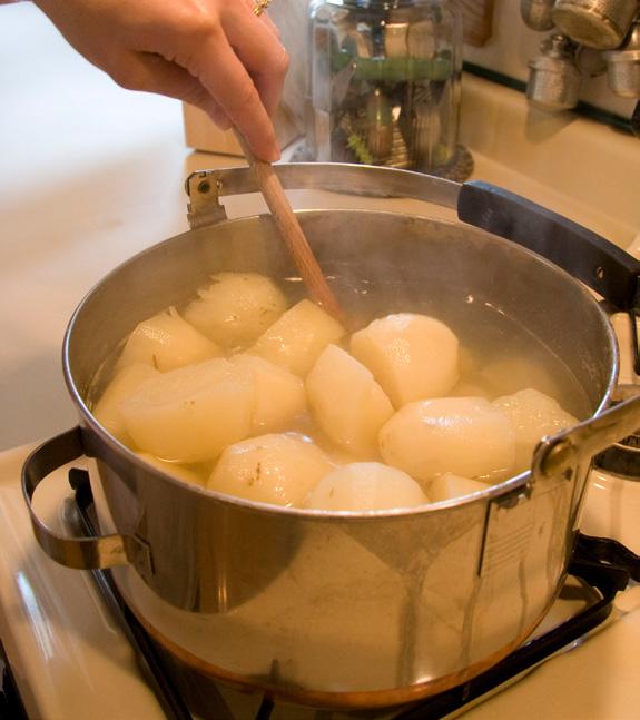 Step 1 Boiling Peel 2 to 2 ½ lbs of russet potatoes. Rinse and cut potatoes in half and then quarters.