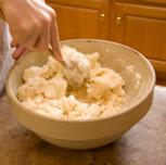 Once added, stir until most of the flour is worked in (loose crumbles).