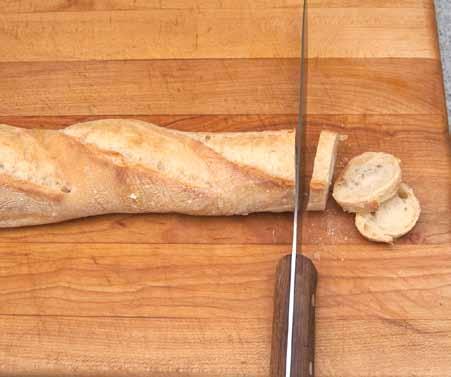 7 5 To prepare the croûtes, cut the baguette into thin slices, about 1/8 inch (3mm) thick.