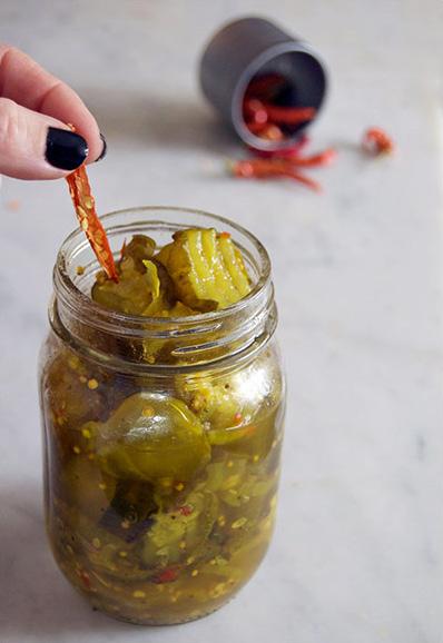 Cut a dried pepper in half (the kind of hot pepper that s about the size of your pinkie finger) and drop it into a jar of store-bought sweet pickles. And you re done. I know. So easy.