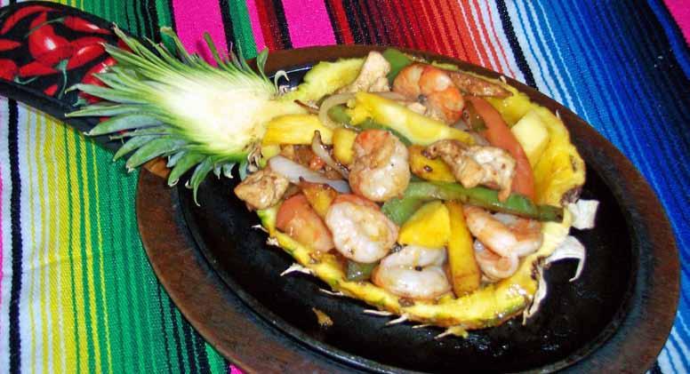 95 Steak and chicken with tomatoes, onions and bell peppers. Fajitas Texanas 14.95 meat grilled with onions, bell peppers and tomatoes. Shrimp Fajitas 17.