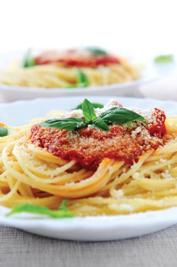5 OriginO Tomatoes, seeded and diced 4 cloves garlic, minced ½ cup chopped, fresh basil ½ cup olive oil salt to taste 2 tablespoons grated Parmesan cheese 1 pound pasta 1.