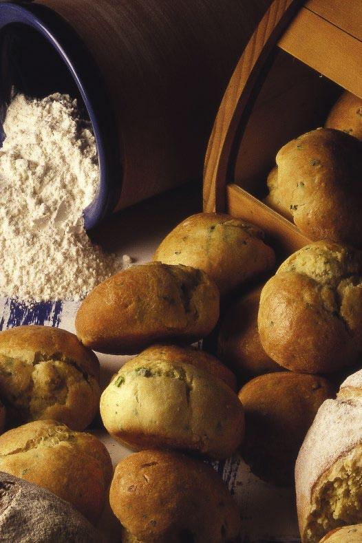 40 > HOME BAKING sweet and savory muffins > 41 herb rolls Cooking time: 40 minutes - Preparation time: 35 minutes > 90 g/3 oz butter > 8 spring onions, finely chopped > 315 g/10 oz flour > 125 g/4 oz