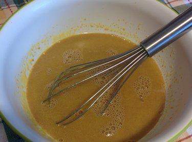 In a separate bowl whisk together the egg yolks, oil, coffee (or water).
