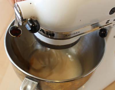 Once the gelatin is just warm, begin to beat it with a whisk attachment.
