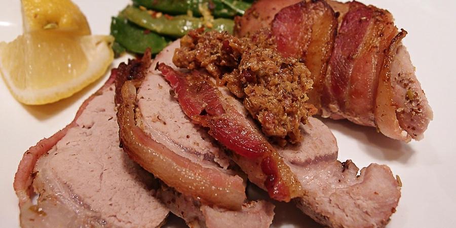 Bacon Wrapped Pork Tenderloin This makes 1 total servings with leftovers. In total this comes out to 418 Calories, 20g Fats, 0.3g Net Carbs, and 54g Protein. Ingredients 1/2 lb.