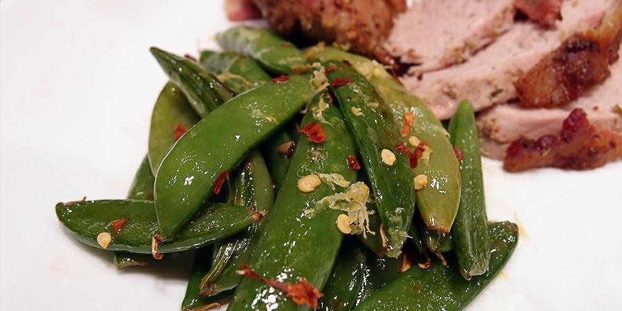 Bacon Infused Sugar Snap Peas Yields 3 total servings. Per Serving, you're looking at: 147 Calories, 13.3g Fats, 4.3g Net Carbs, and 1.3g Protein.