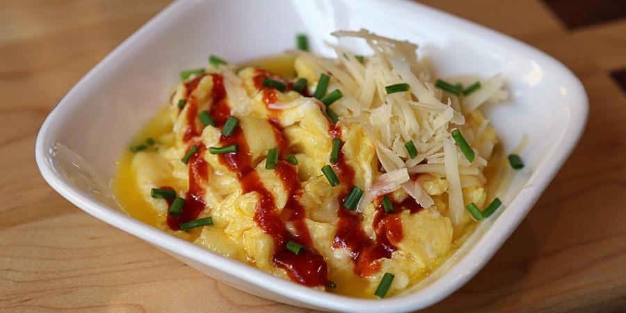 Cheesy Scrambled Eggs Yields 1 serving. Per serving, it is: 453 Calories, 43g Fats, 1.2g Net Carbs, and 19g Protein. Ingredients 2 Large Eggs 2 Tbsp. Butter 1 Oz. Cheddar Cheese Instructions 1.