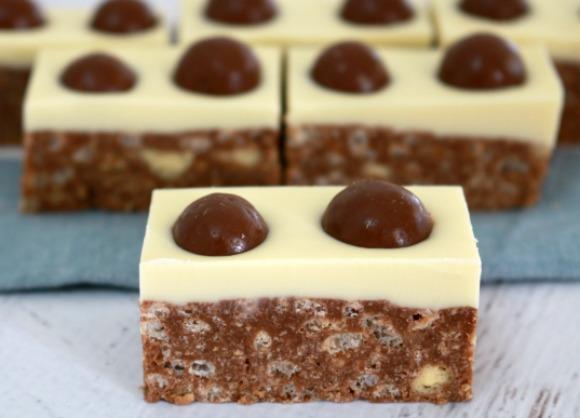 MALTESER SLICE 9. 10. 1 1 Line a 22cm X 32cm rectangular baking tray with baking paper. Crush biscuits in a food processor.
