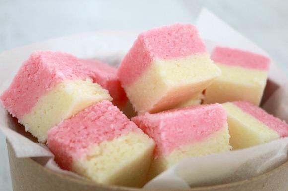COCONUT ICE 300g (2 cups) pure icing sugar ¼ tsp cream of tartar 395g can sweetened condensed milk 3½ cups desiccated coconut 5-6 drops pink food colouring Grease and line a 20 X 30cm rectangular