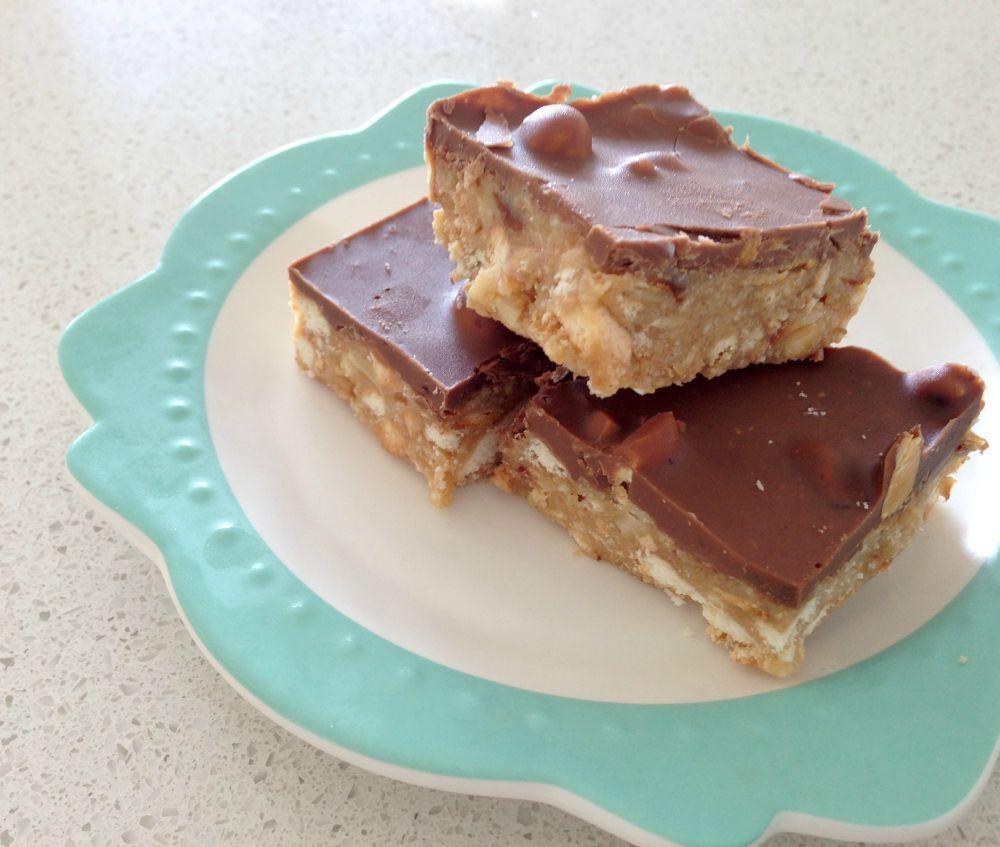 CHOCOLATE & HAZELNUT SLICE 1 packet of Arrowroot biscuits 100g flaked almonds 220g block of Cadbury Hazelnut chocolate 60g of copha 2 tbs golden syrup 3/4 cup condensed milk 125g of butter Line a