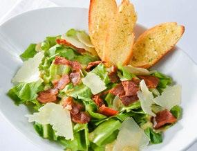 CAESAR SALAD Crisp hearts of romaine with garlic-anchovy dressing, herbed croutons, aged parmesan cheese and crispy