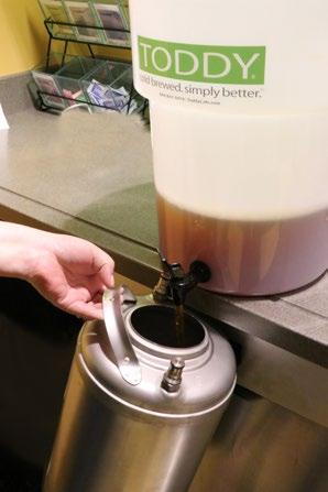 proper amount of hot filtered water to Toddy using gallon pitcher Add