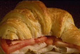 95 Exquisitely French, Sliced Turkey Breast, Baked Ham and Swiss Cheese Served Hot in a Delicate French Pastry, Laced with a Ribbon of Hollandaise Ham & Swiss Cheese Croissant 8.