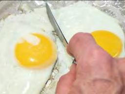 Lift the egg as shown and either put it on a plate if you re