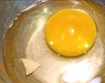 Then gently pull apart the shell to release the egg white and yolk into the bowl.