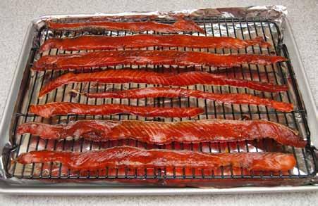 6 Place a nonstick rack* on a cookie sheet (which I lined with foil for easier cleaning) and arrange the stips of fish on the rack, allowing space between the strips.