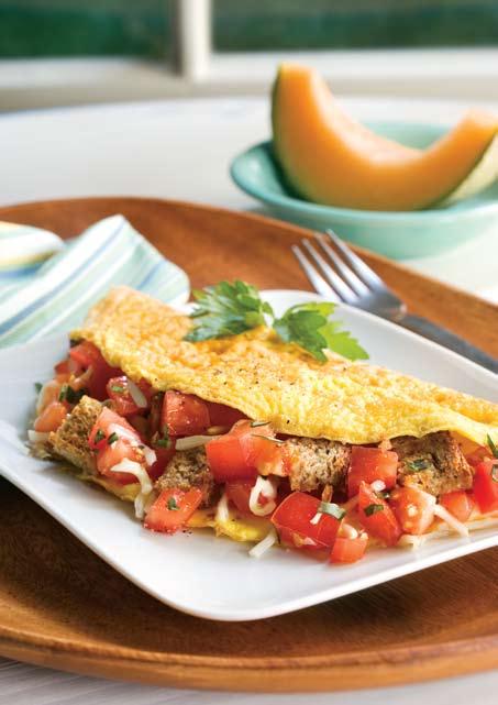 Tomato and Garlic Omelet This unique omelet includes vegetables and whole wheat bread for a balanced breakfast. Makes 1 serving. 1 omelet per serving.