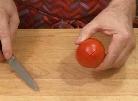 1 STEP-BY-STEP 2 The tomato will be easier to peel if the skin is cut at one end.