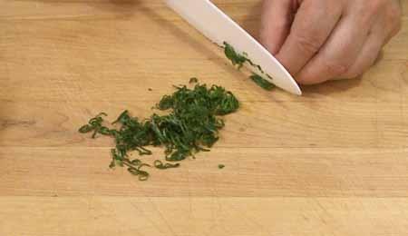 9 6 As an optional garnish, you can roll up a few fresh basil leaves into a little cigar-shaped