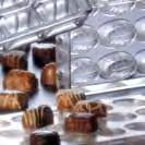 pastry bags and a variety of small devic, made of metal and plastic.
