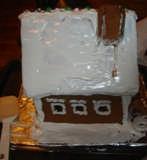 Step 21 - Ice the roof (if you want a snow-covered roof) and then attach the chimney I wait to do