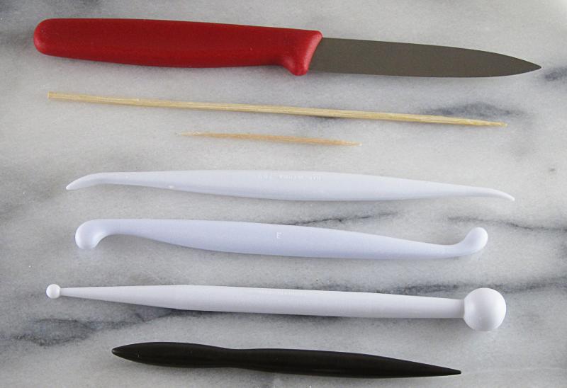 Cornflour (cornstarch) Pizza cutter Pencil Pin Ruler Thin cardboard Secateurs (for cutting skewers) Pasta machine (thickness